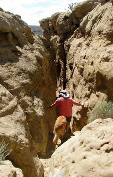 It's time to squeeze back down the crevice. We kept Morgan between us because it was so steep.