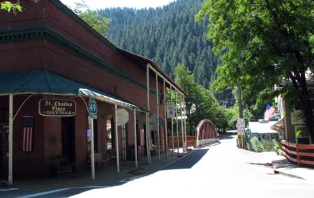 Hwy 49 enters Downieville then turn right in the center of town to a one lane bridge. We drove this bridge pulling our fifth wheel and I've riden it on my bike. Traffic is light so not usually a problem.
