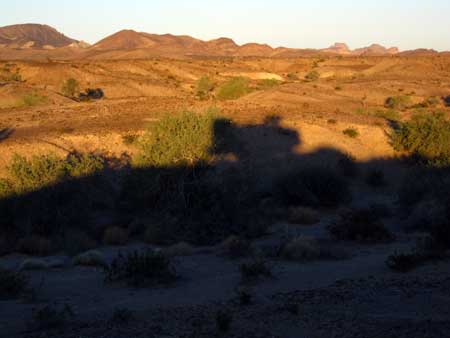 Sunrise shadow of our trailer on a west hill