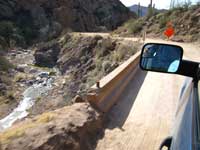 Over a one lane bridge approaching road construction