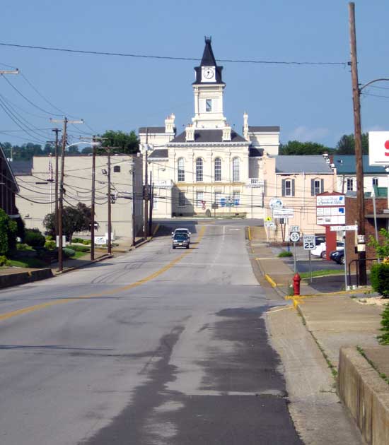 The historical county seat in Columbia, KY; Behind: the new county court house