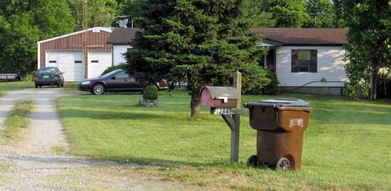 At the end of the Highway to Heaven: a doublewide with detached two car garage