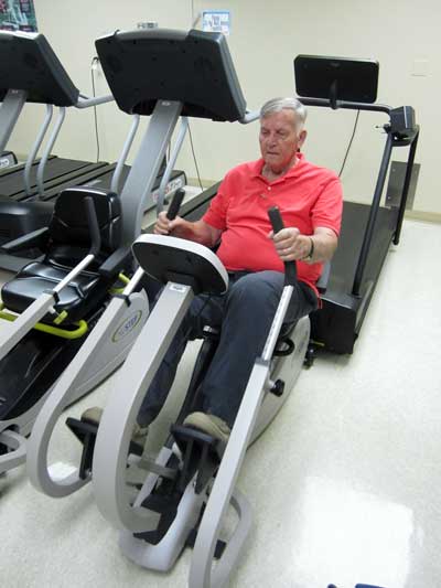 Dad using the NuStep machine