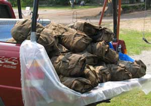 Roasts wrapped in aluminum foil and burlap