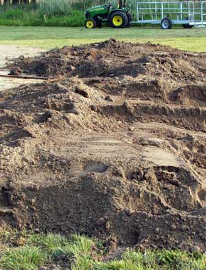 The pit is buried for cooking the meet all night