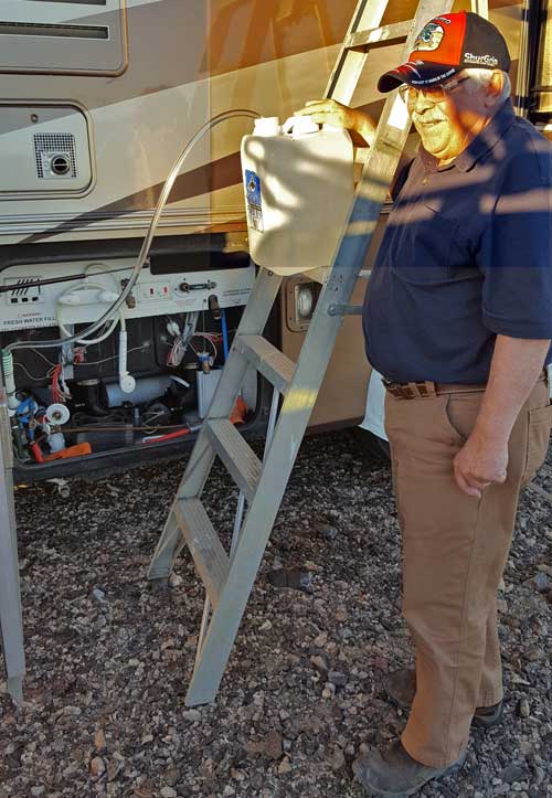 Gary adds water to his motorhome