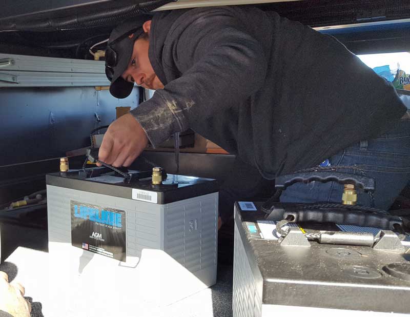 Adrian loads the new Lifeline Batteries into the battery bay