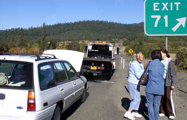 Who get's to sit up front with the tow truck driver?