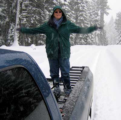 Gwen is adding weight to the back end of the truck for better traction.