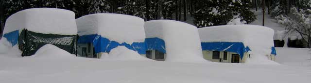 The resort schooner are up to their windows in snow.