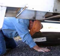 Then you crawl under the trailer and pull out the spare