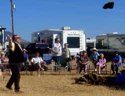 Tom shows the RV crowd how to throw a cow chip