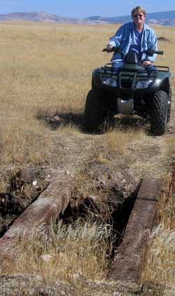 Gwen tries the ATV around the ranch.