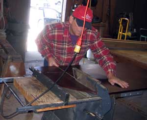 I use the shop tablesaw to trim the top