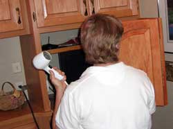 Doors fold out of the way for TV or hair drying