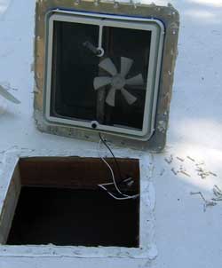 The many screws are removed and old vent is pulled from the roof