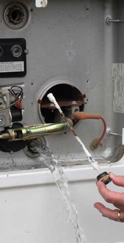 Drain the tank and clean the ion rod.