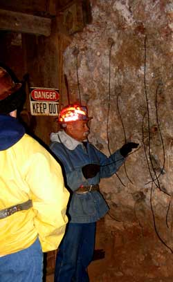 A dozen holes are drilled 8 feet into the rock then loaded with dynamite