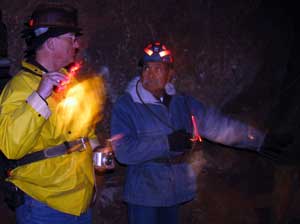 Neto points to a shaft where a pocket of copper ore was found