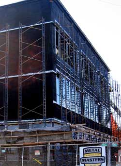 Scaffolding installed to apply bricks