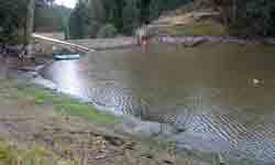 View of what's left of Little Hyatt Lake and a crumbling dam