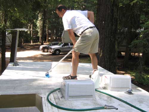 Using a brush with Thetford Rubber Roof Cleaner