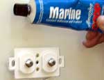Use Marine Goop to seal around the holes