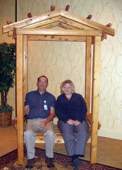 Dale and Anna sitting in the arbor.